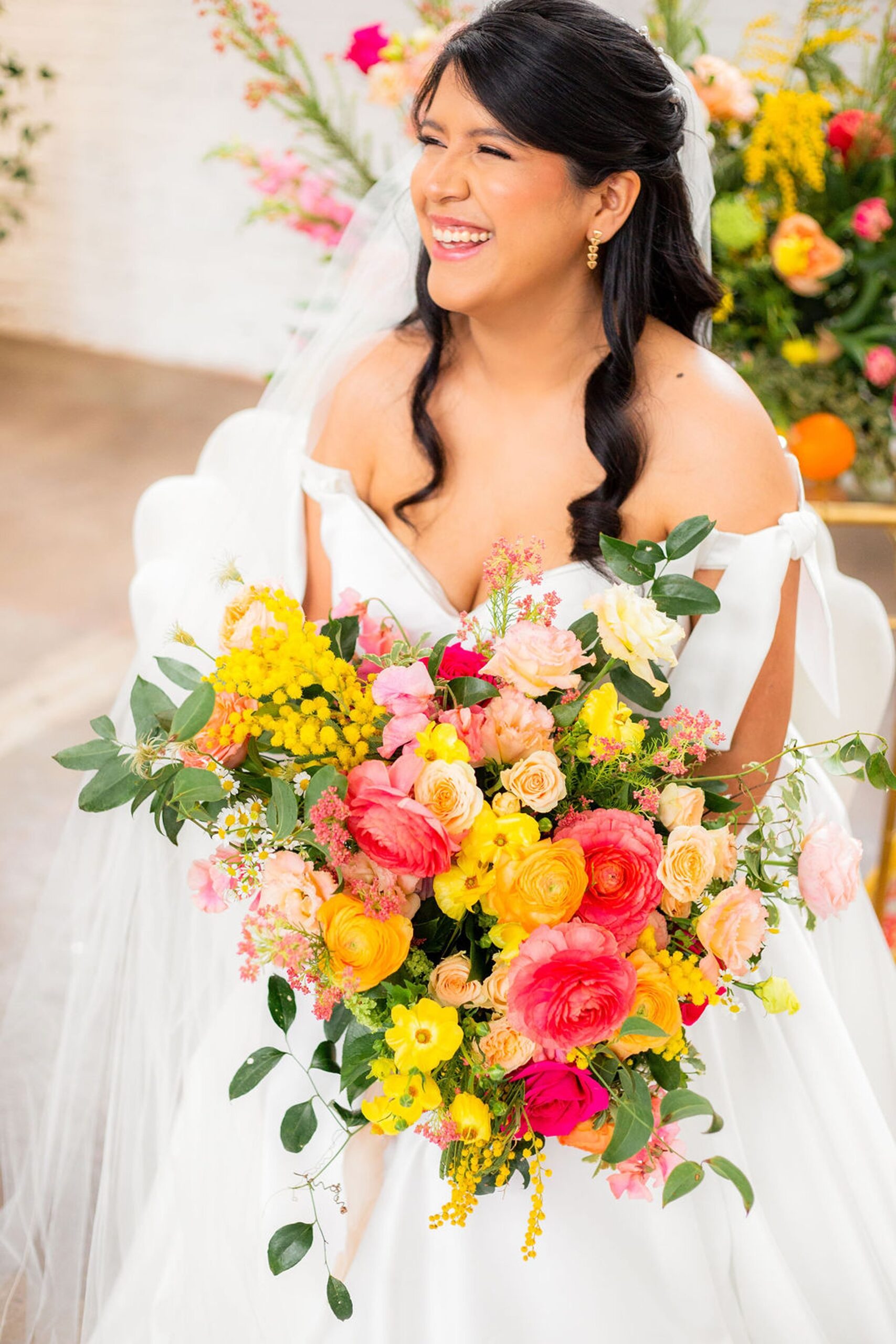 Bride holding bright and colorful bouquet for Rhode Island wedding
