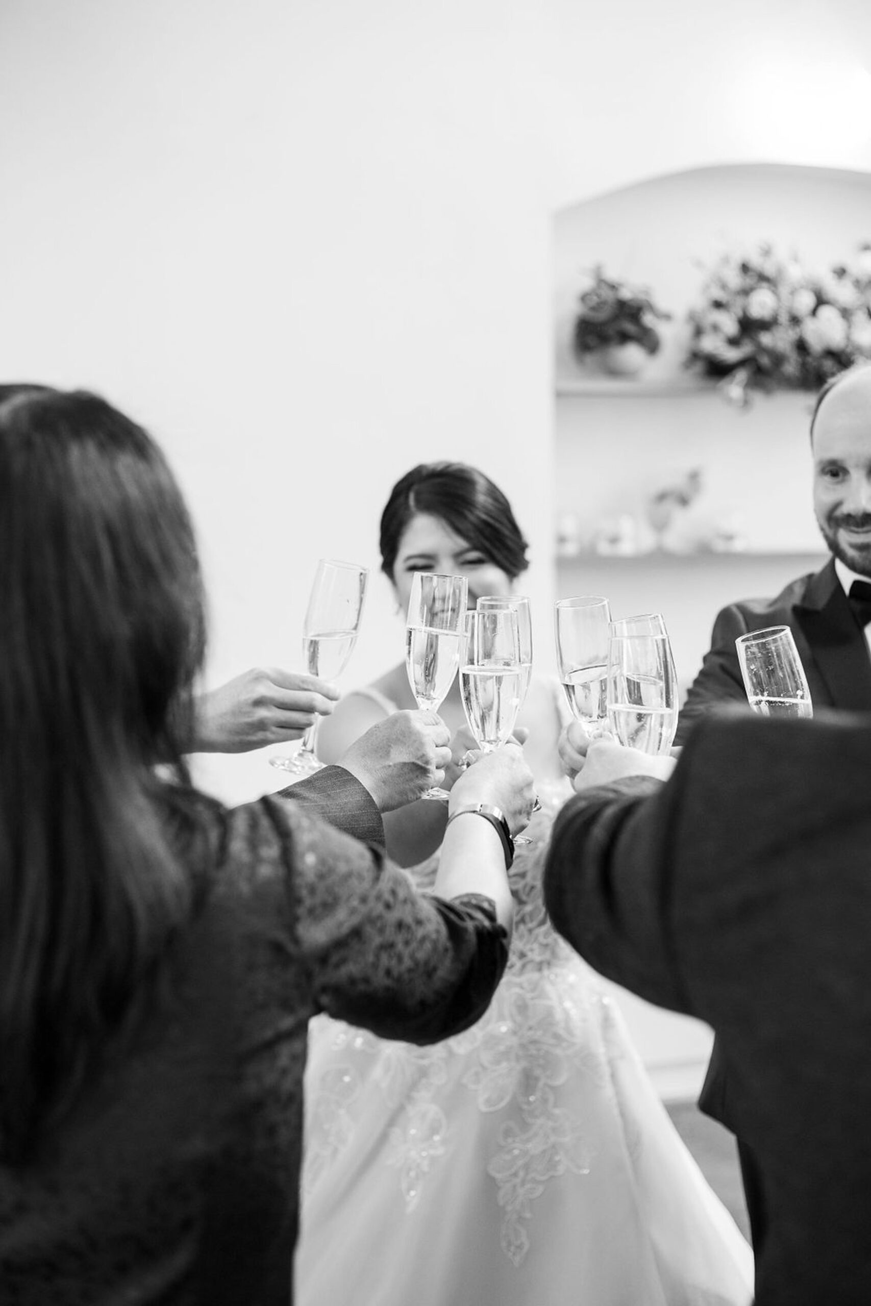 Black and white candid photos of cheersing